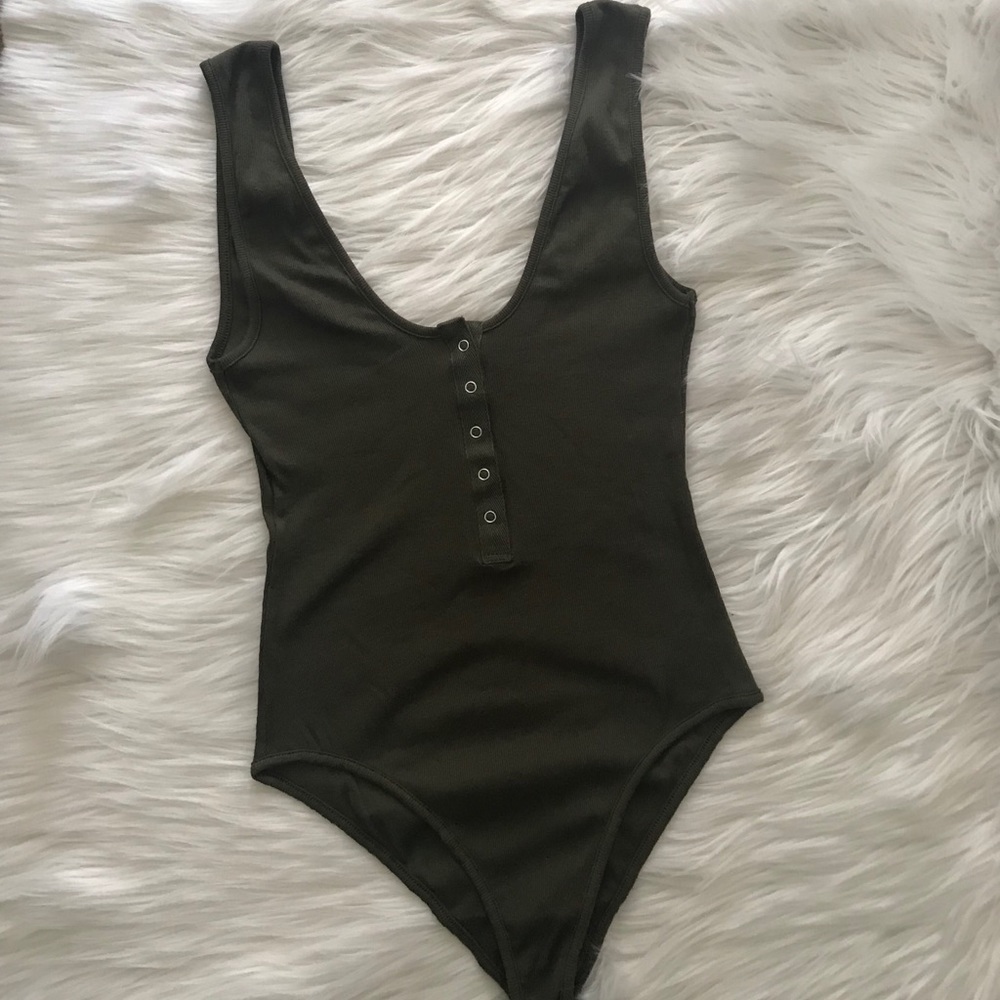NWT.   Free People body suit top.  Size XS.